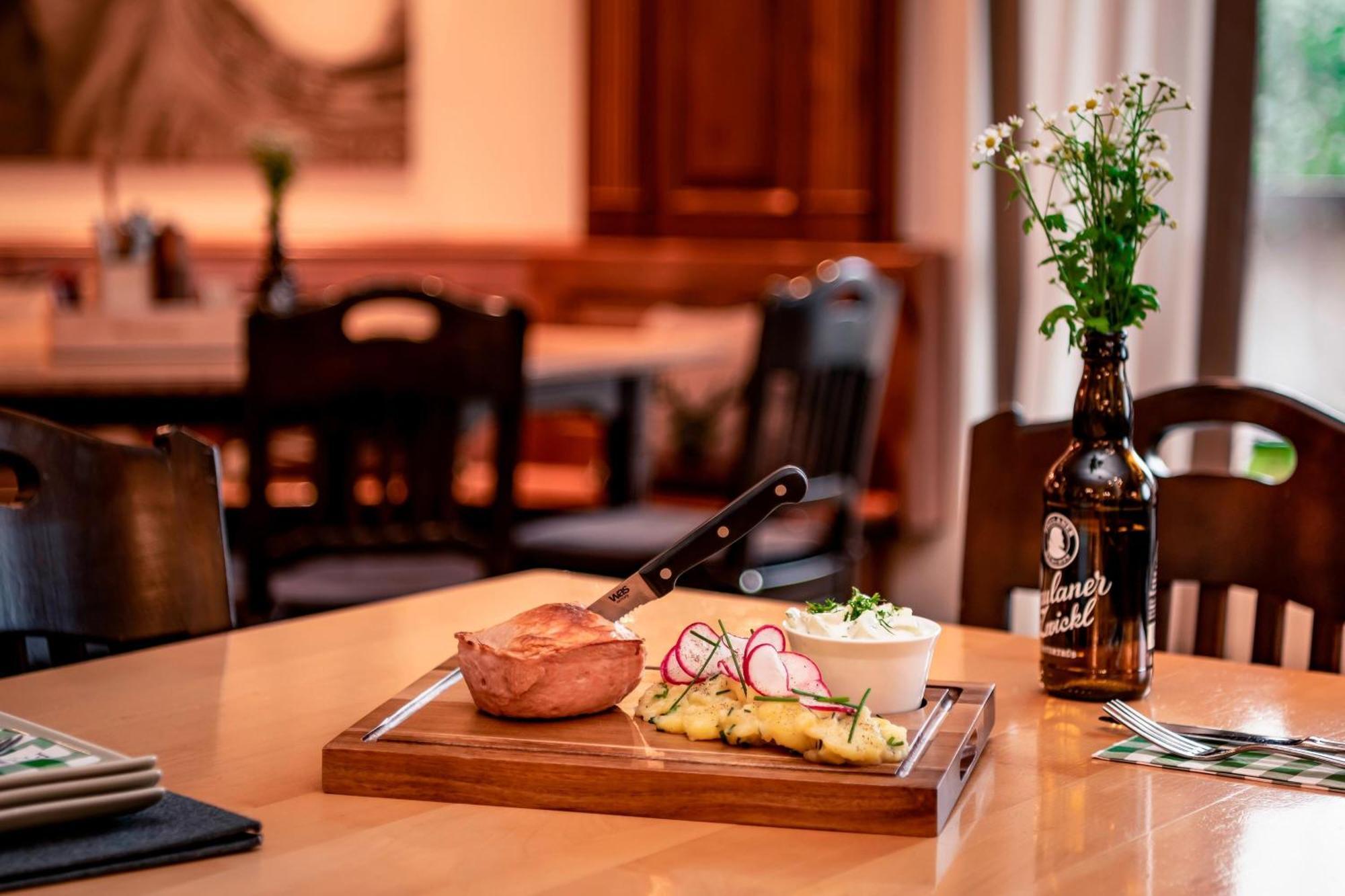 The Westin Grand Munich Hotel Kültér fotó A traditional German meal with a bottle of Kölschstange